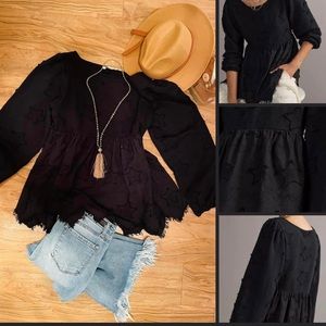 Anthropologie m, Forever That Girl.
Black top, embroidered stars, jagged hem.